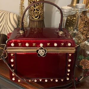 Lovely wine color patent boutique bag